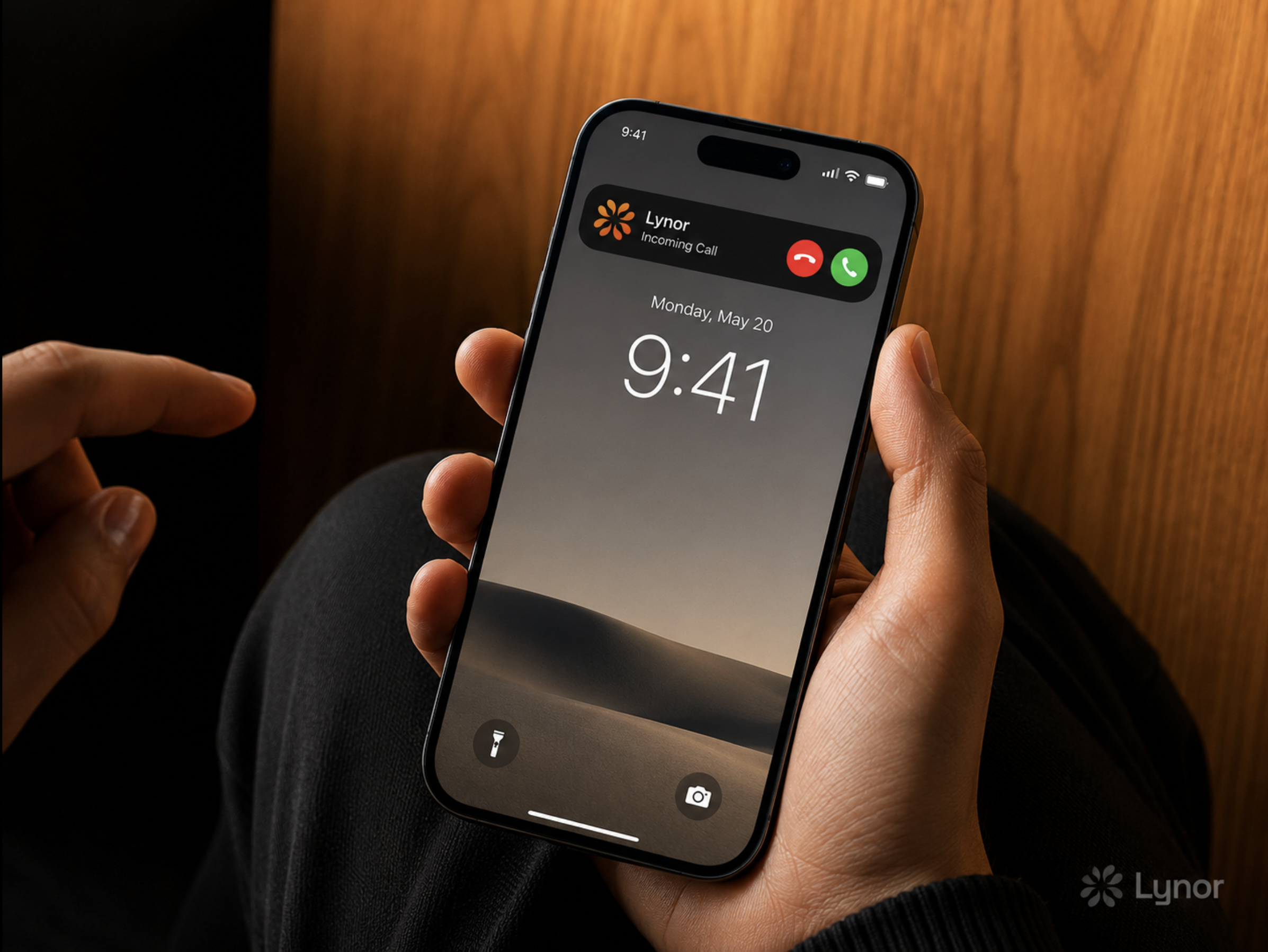 An iPhone showing an incoming call from Lynor.