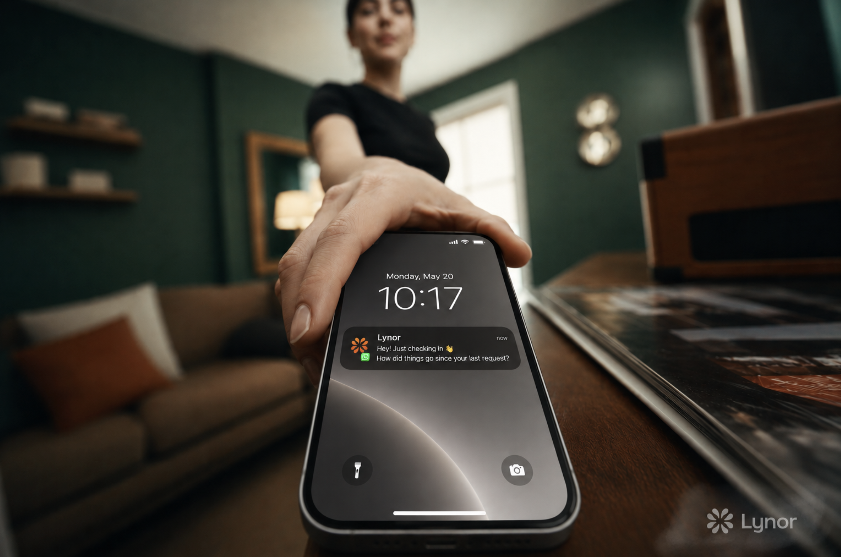 An iPhone showing a WhatsApp follow-up notification from Lynor.